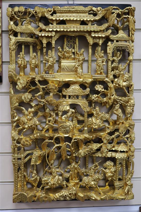 Six Chinese carved giltwood panels of soldiers amid pavilions